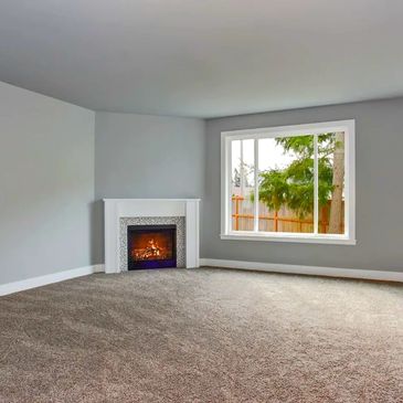 Carpet flooring installed in the living area of a residential unit.