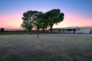Professional photograph of twilight at a Sayre, OK home for sale