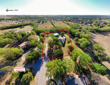 Aerial drone photo of creek through wooded land, Elk City, OK