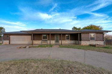Street view of a home for sale in Elk City, OK. Professional photo MLS-ready