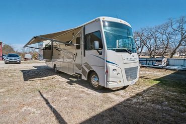 Professional photo of the exterior of an RV listed for sale in North Texas