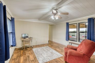 Professional photograph of a living room in a Sayre, Ok home listed for sale.