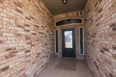 Entry and front door of a home for sale in Seiling, Oklahoma. Ready for listing.