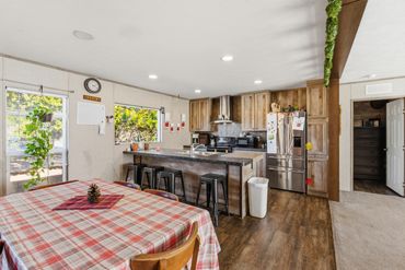 View of the dining room and kitchen of a home on 8 acres in rural western Oklahoma, near Fay