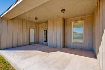 Patio and back door of a newly built home in Seiling, OK. Ready for MLS listing