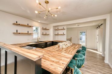 Remodeled Elk City kitchen with wood countertops and black cabinets