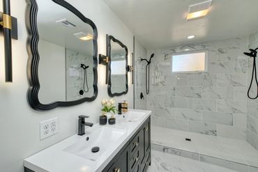 Remodeled Elk City bathroom with double vanity and walk in shower