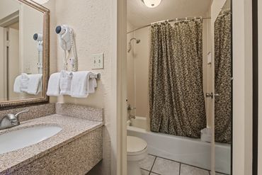 Bathroom with double sinks at Northwest Inn hotel, Woodward, OK