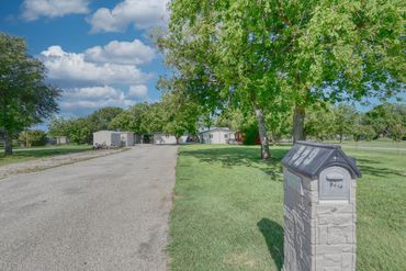 Photograph of driveway leading to a lakeside home in north Texas
