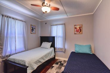 Photo of a bedroom with two twin beds in a home in western Oklahoma, listed on Airbnb