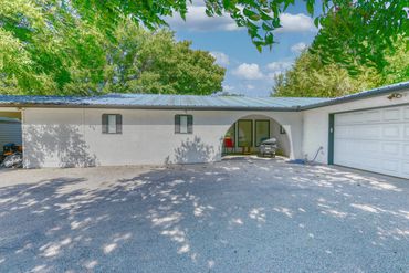 Photograph of the driveway and front entrance to a lakeside home near Graham, TX