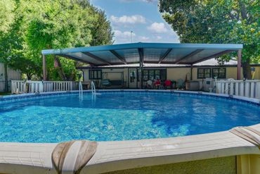 Photograph of the pool in the backyard of a home in rural north Texas