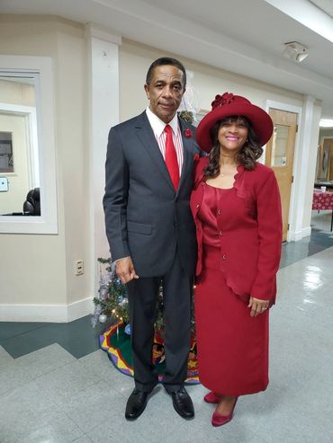 couple wearing dresses looking front