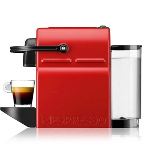 Red Nespresso coffee machine with a cup of espresso.