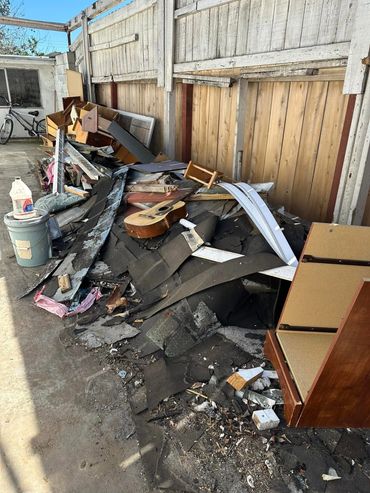 Miscellaneous junk piling up on customers side yard
