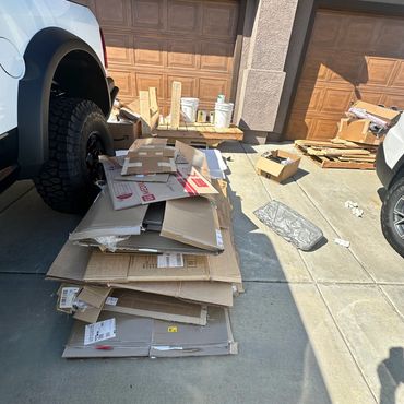 Boxes piling up in a customer's driveway