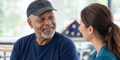 Man receiving support from a healthcare professional.