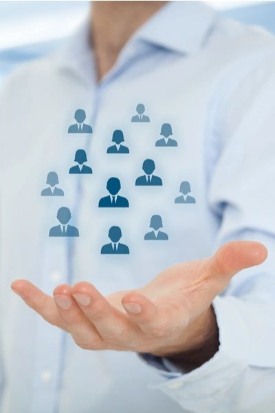 human shapes floating above an open palm