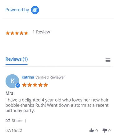 A five star review of a pom pom hair bobble by Katrina