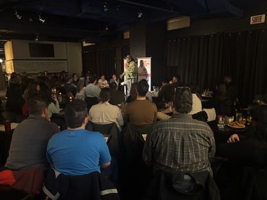Laugh-out-loud moments at a comedy show in Montreal with a captivated audience.