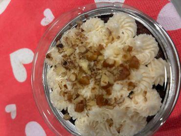 Mini Carrot Cake topped with cream cheese frosting and crunchy pecans.