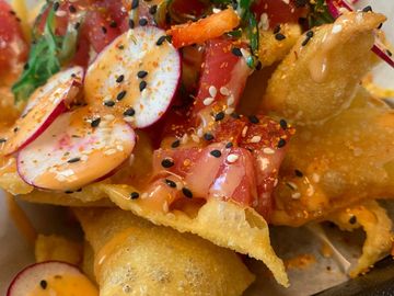 Poke Nachoes with shaved radish, Wakame. togarashi and Honey Sriracha