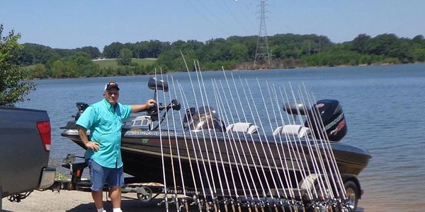 Capt Jake Davis with Duckett Fishing Rods and Triton, ready to take you out for a day on the lake