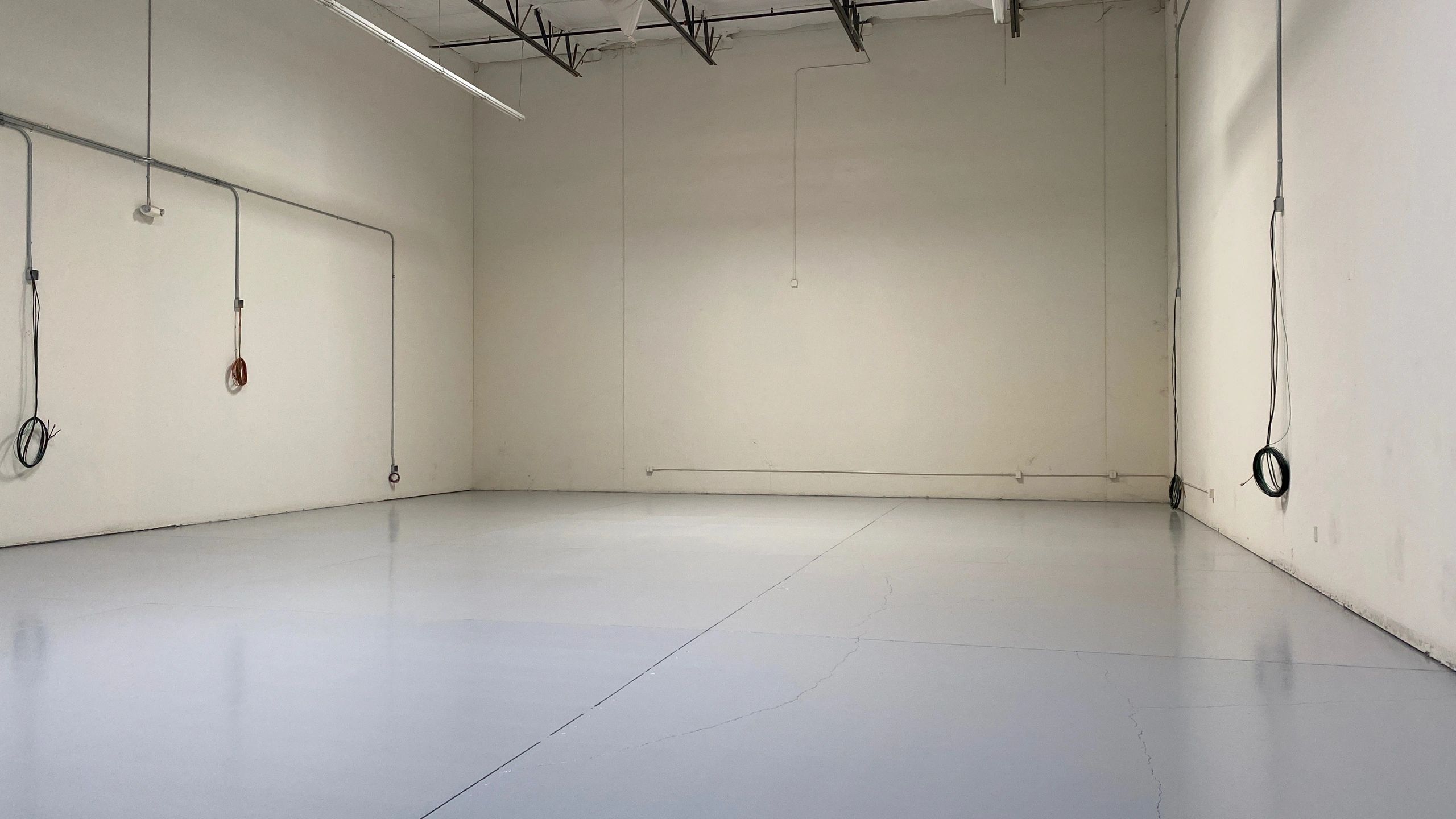 Epoxy with urethane and grip additive in commercial warehouse.