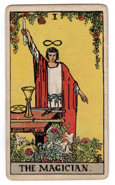 The Magician tarot card showing a figure with a wand and mystical symbols.