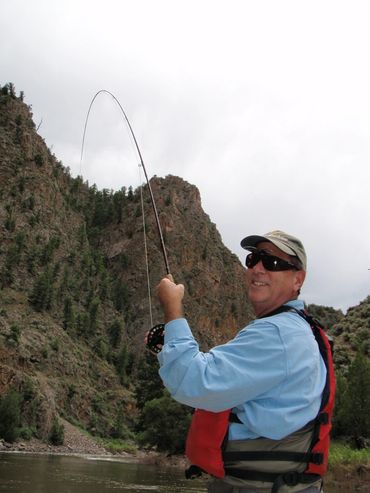 man holding a fishing pole