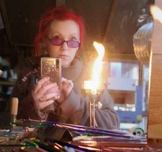  cremation memorial keepsake artist the molten pixie in front of her blow torch 