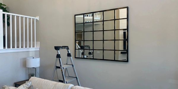 Wall mirror made from square panels in living room.