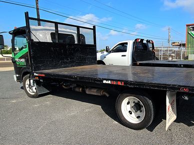 Our delivery flatbeds are waiting to be loaded up to deliver materials to a job site.