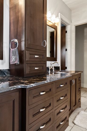 Silver accents on dark brown surfaces.