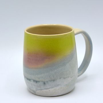 potttery mug with graduated glaze yellow to white from top to bottom