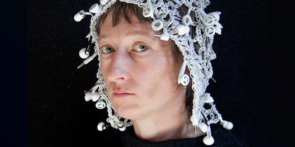 Elinor Widden - Selfie wearing cap crotcheted from white earbuds and earbud wires
