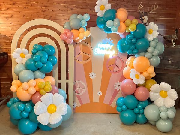 Rainbow wall and custom backdrop rental with balloon garland Charlotte, NC