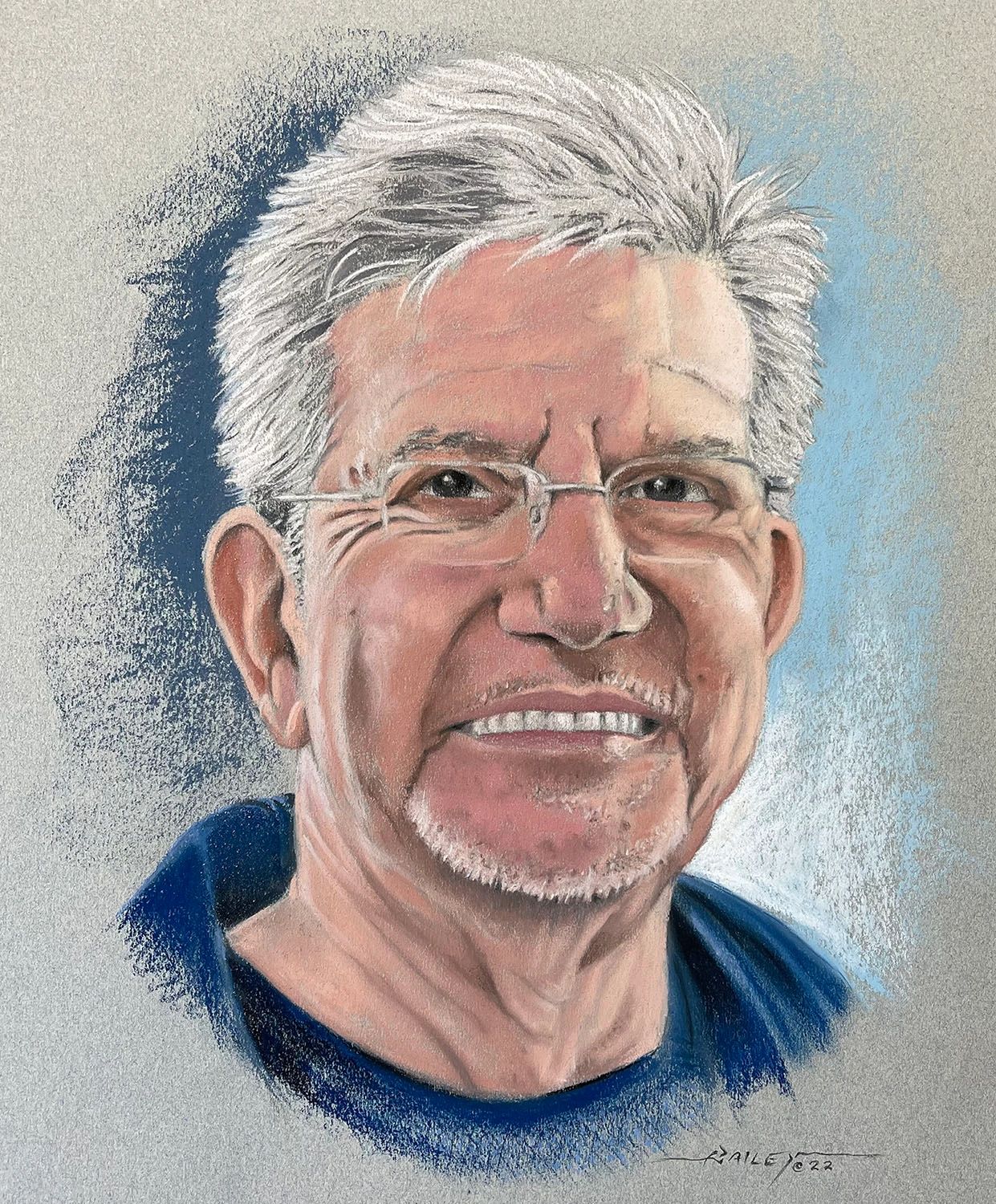 Chalk pastel portrait of a man with glasses smiling.