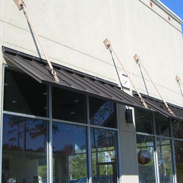 overhead metal awning bronze on commercial buildings