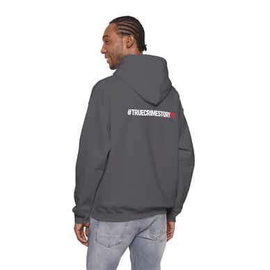 Man in gray hoodie with #TRUECRIMESTORY text on the back.