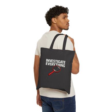 Man carrying a black tote bag with 'Investigate Everything' and a magnifying glass design.