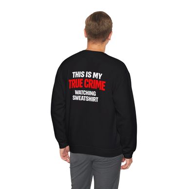 Person wearing a black sweatshirt with a humorous true crime statement on the back.