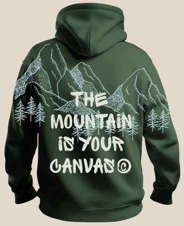 Green hoodie with mountain and tree design and inspirational text on the back.