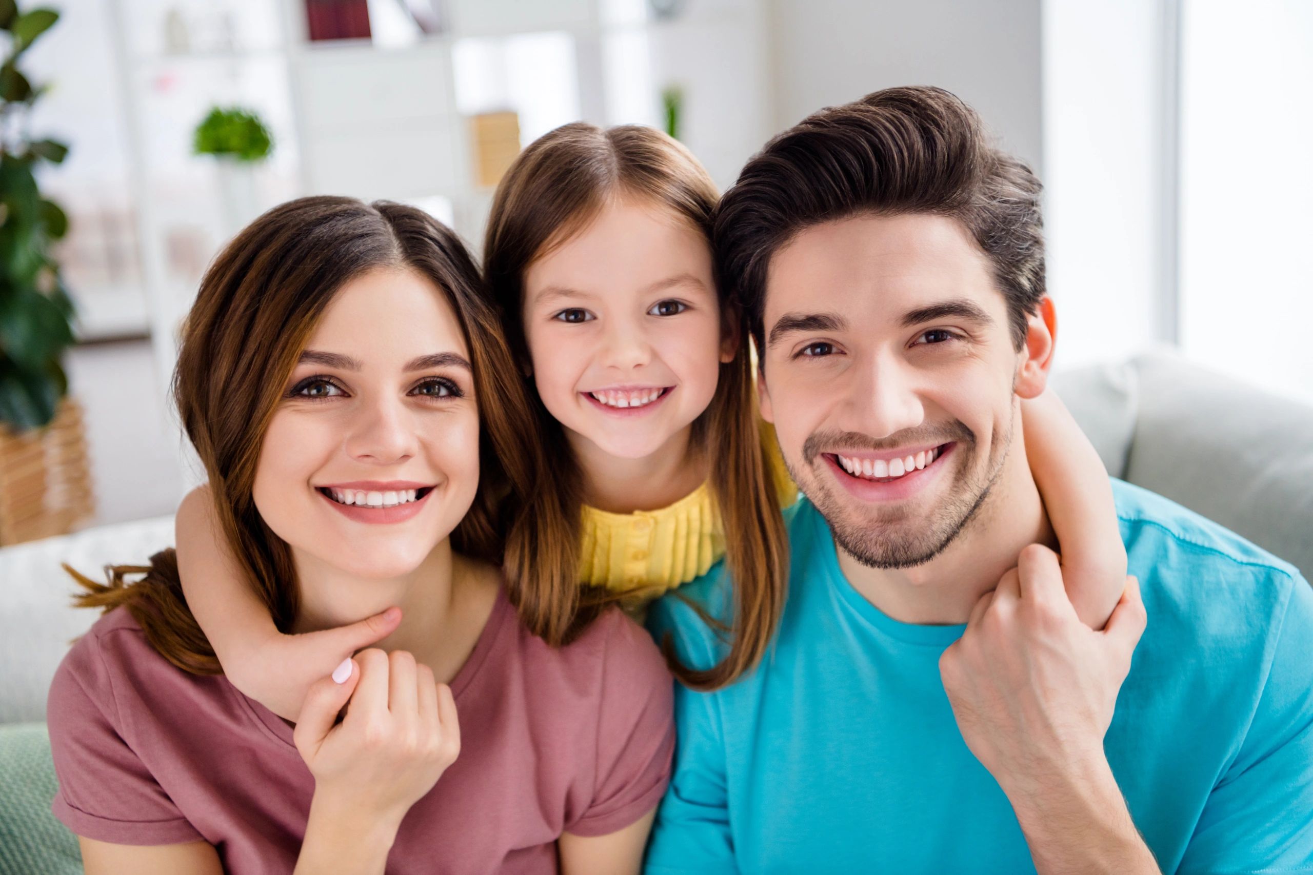 Family of three smiling