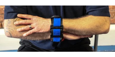man's arms in soft restraint equipment