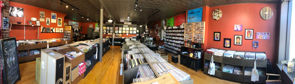 Record store floor full of records