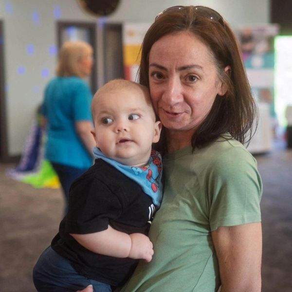 The gentle nanny holding a baby boy