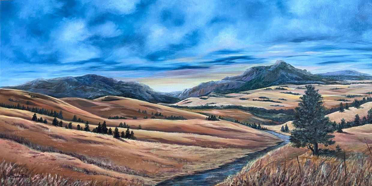 A serene landscape with rolling hills, a stream, and a vibrant blue sky.