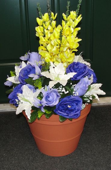 12” Clay Pot w/ Purple Roses, Lavender Rosebuds, White Lilies & Yellow Snapdragons
