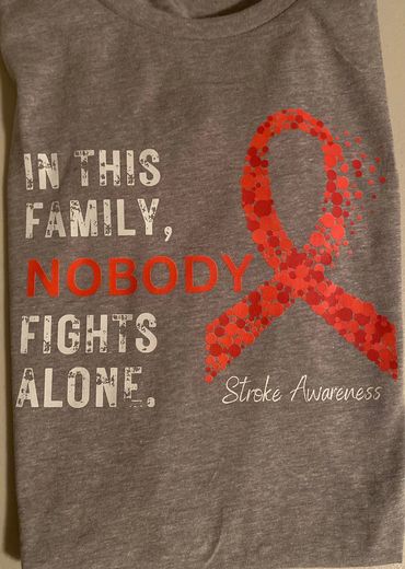 Gray shirt with red stroke awareness ribbon and supportive text.